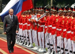 Russian President Vladimir Putin inspects the honour guard during a welcoming ceremony at the presidential palace