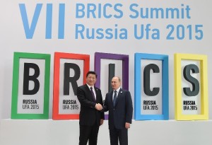 Chinese President Xi Jinping is welcomed by his Russian counterpart Vladimir Putin during BRICS 2015 in UFA