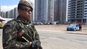 epa05450216 Brazilian army personnel are seen outside the Rio Olympic Games Athletes Village in Rio de Janeiro, Brazil, Sunday, July 31, 2016. The Rio 2016 Olympic Games take place from 05 to 21 August. EPA/DAVE HUNT AUSTRALIA AND NEW ZEALAND OUT