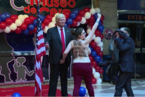 Attivista Femen contro statua Trump